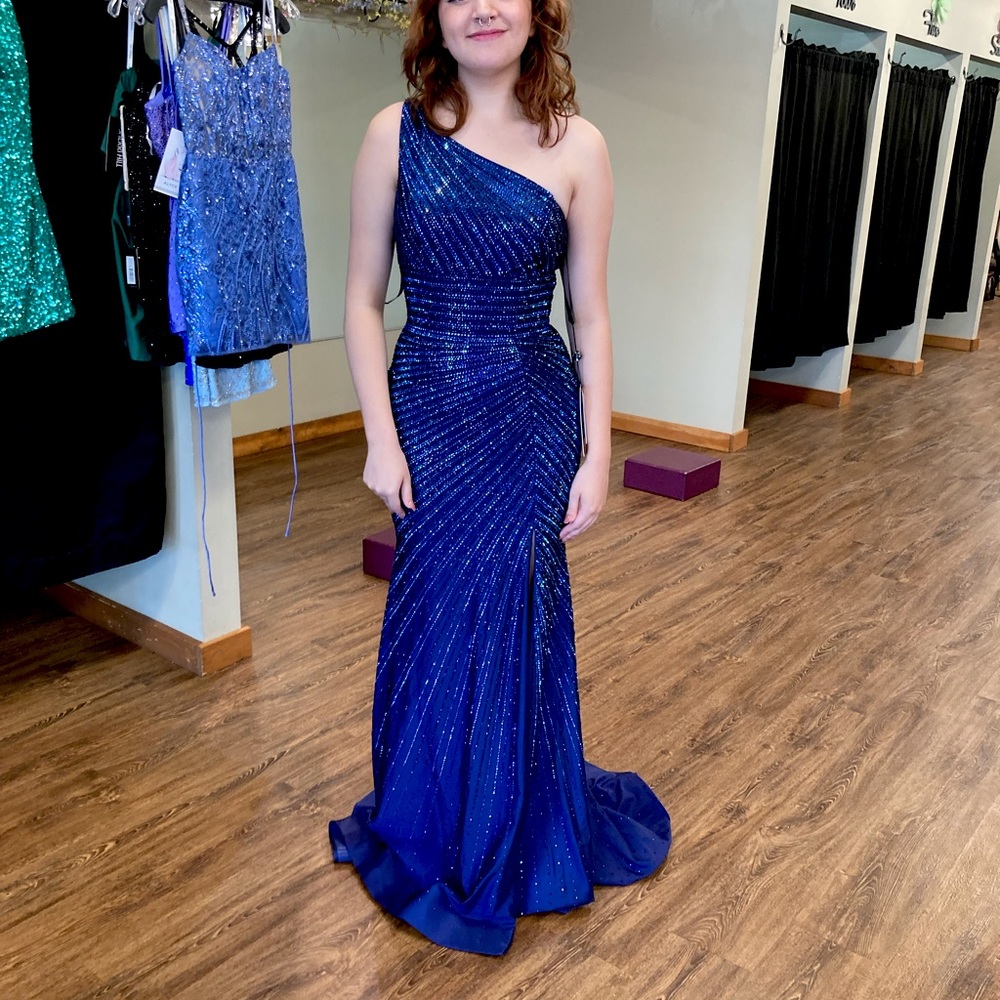 Worn once, no alterations, like new. Gorgeous sapphire blue with train.